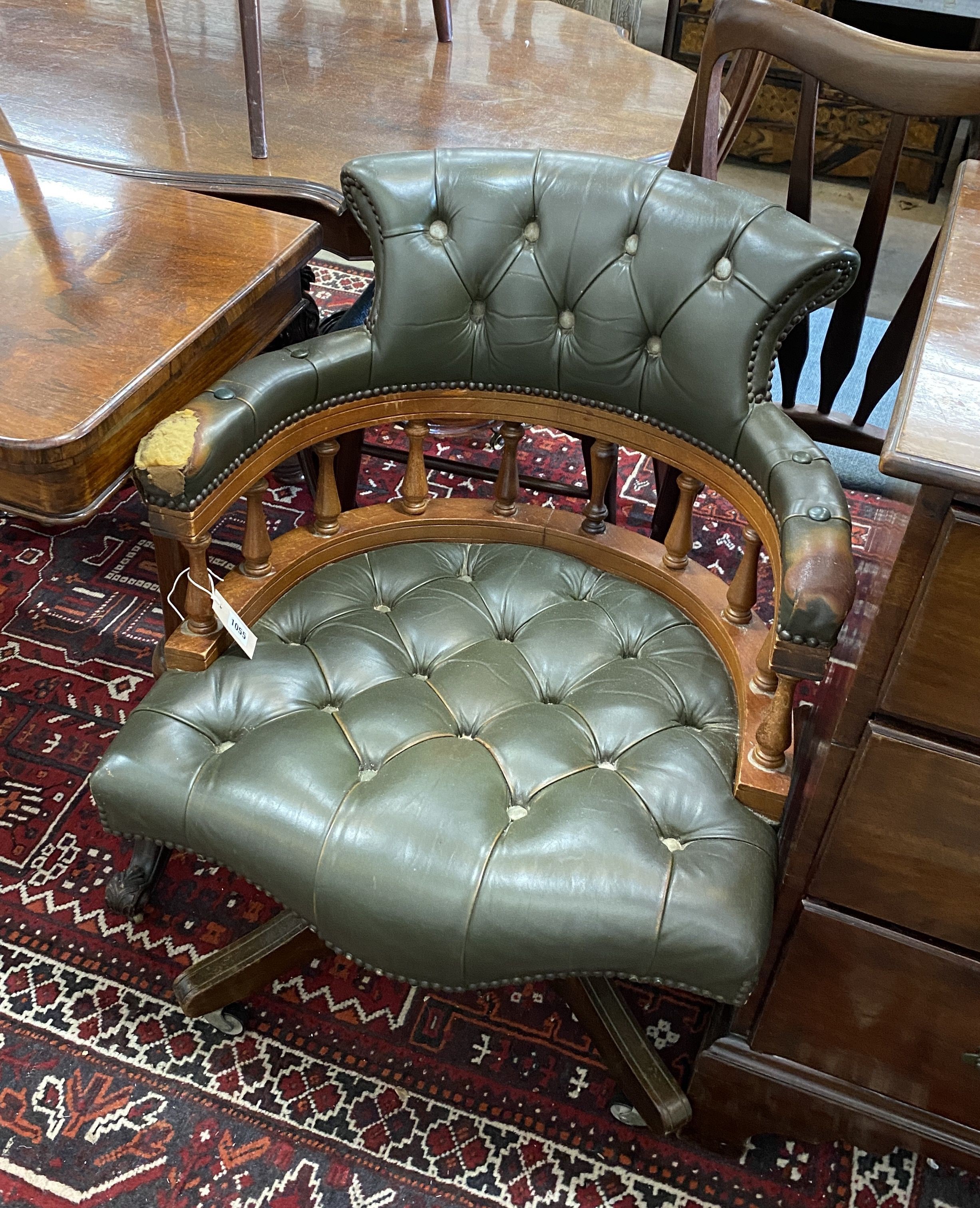 A Victorian style green leather, stained beech swivel desk chair, width 63cm, depth 57cm, height 80cm